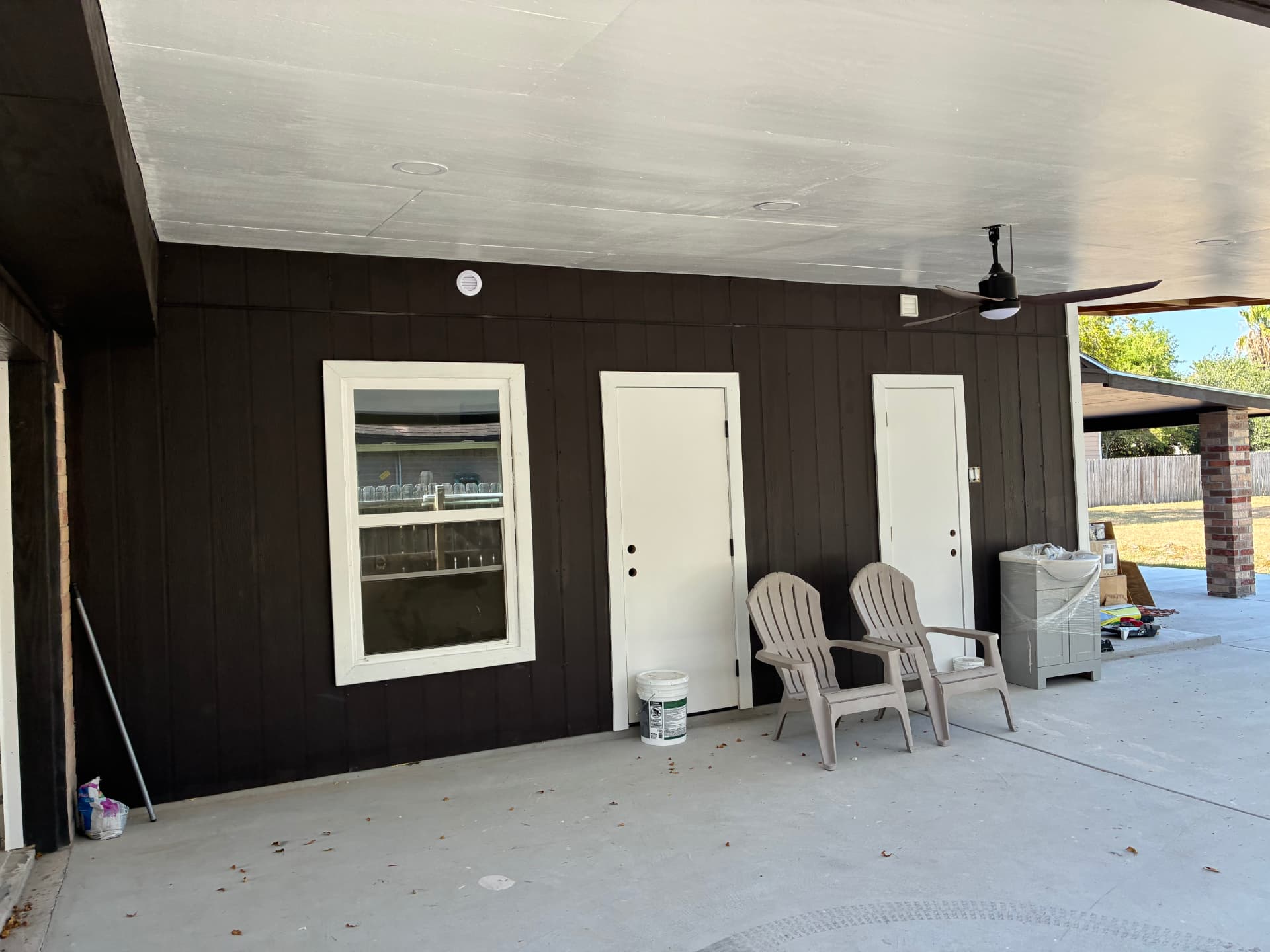 Covered patio addition with painted siding and new slab — Brownsville, TX